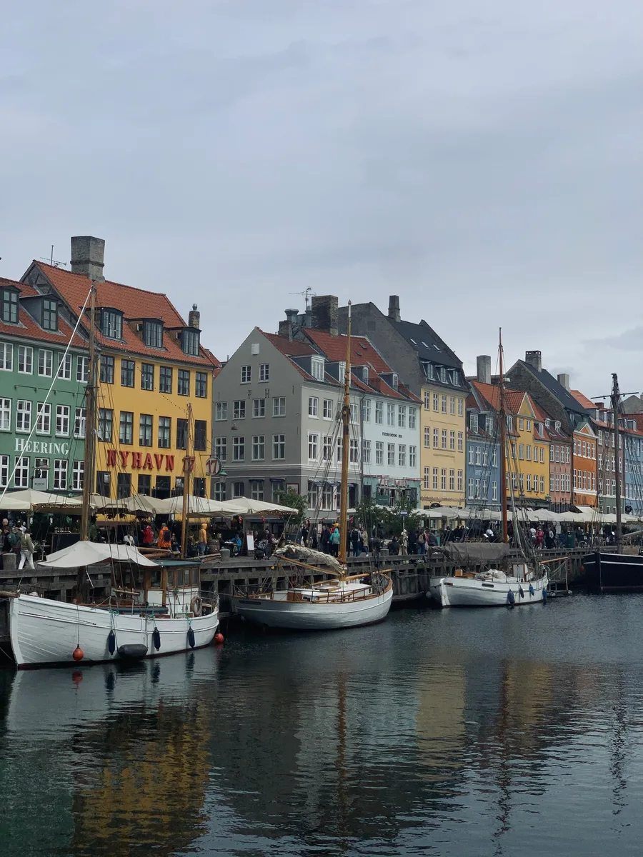 Colorful waterfront buildings and moored boats at Nyhavn