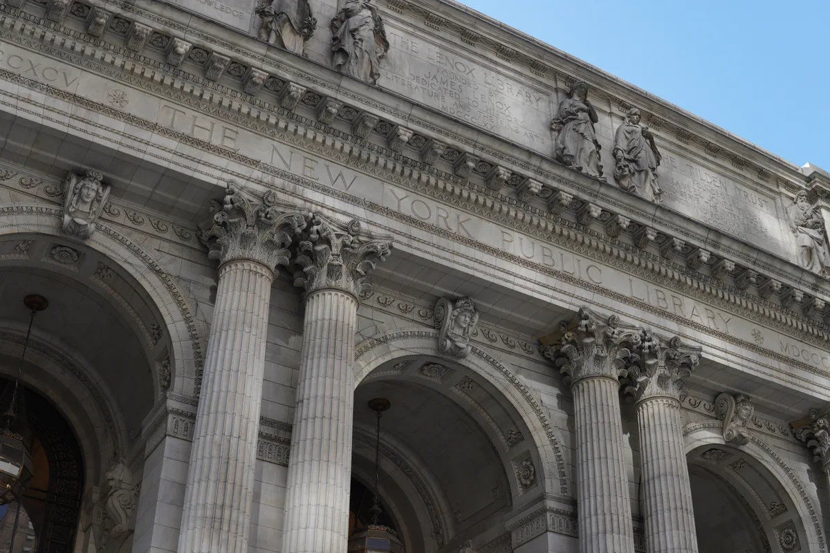 Stone arches and carved figures on the New York Public Library façade